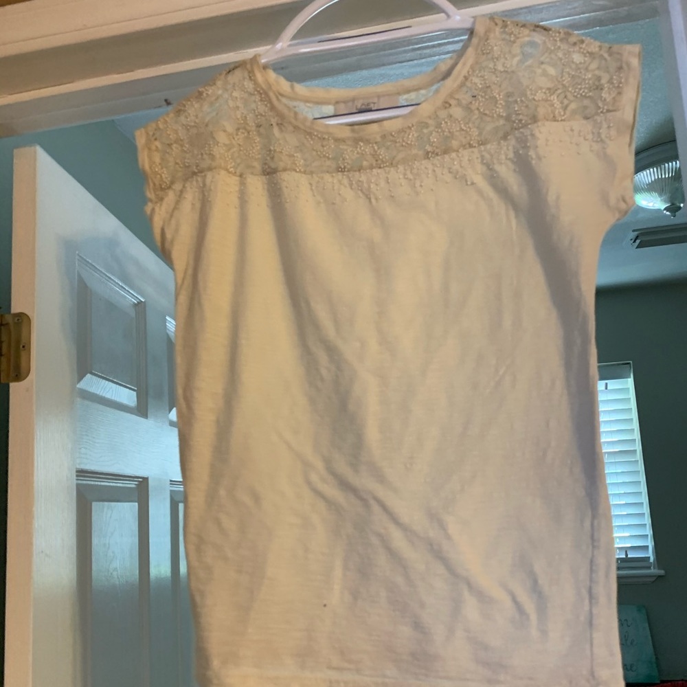 Cream colored woman’s blouse